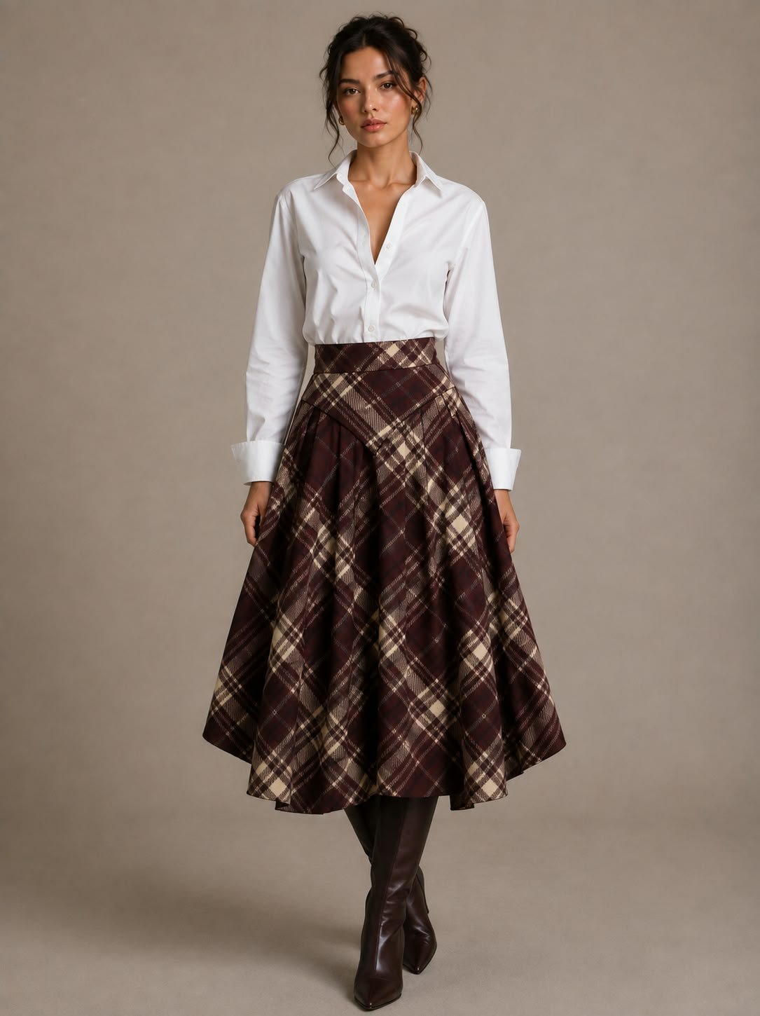Burgundy plaid pleated midi skirt with a white shirt and knee-high boots