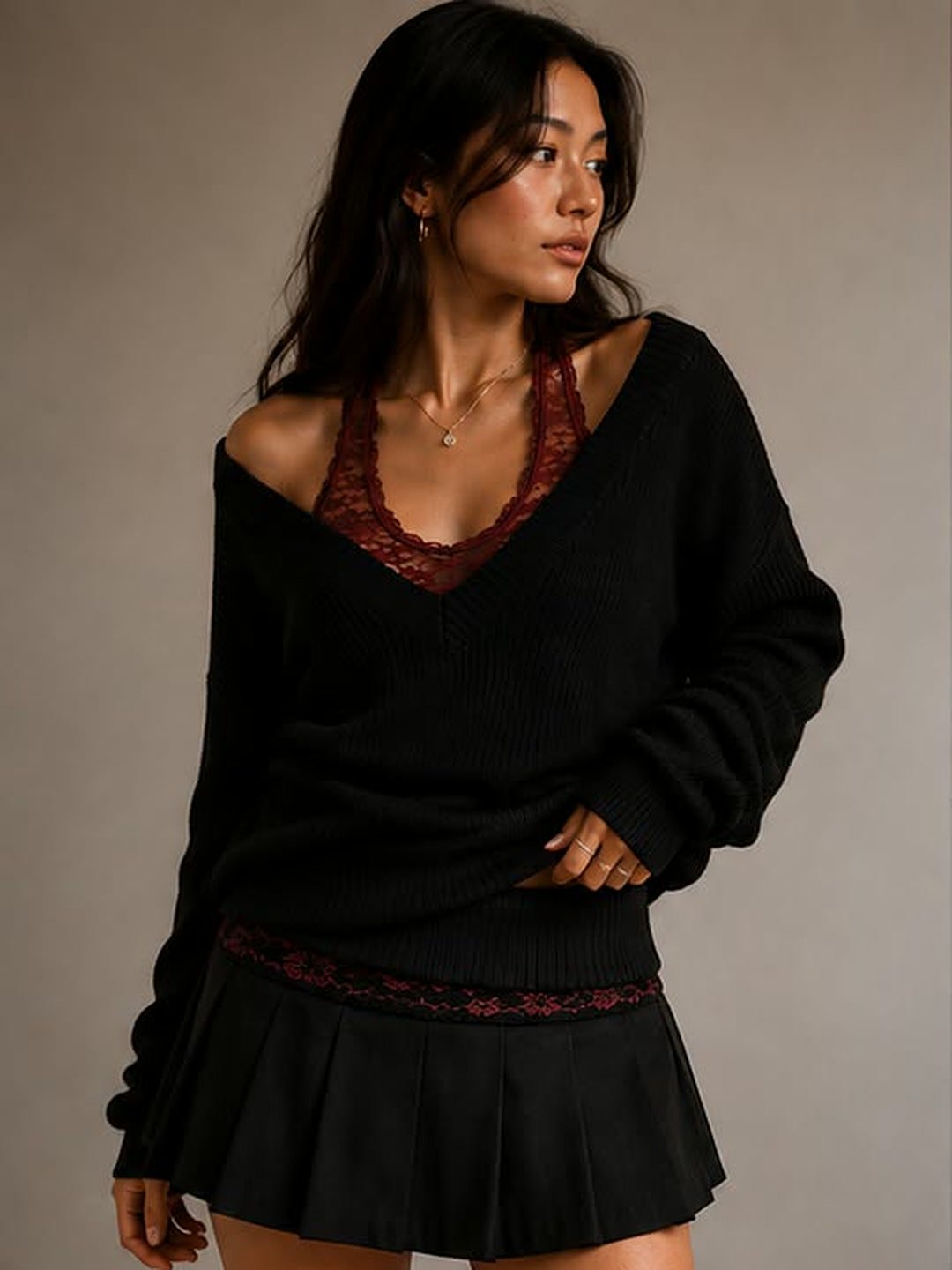 Black knit over a deep red lace tank